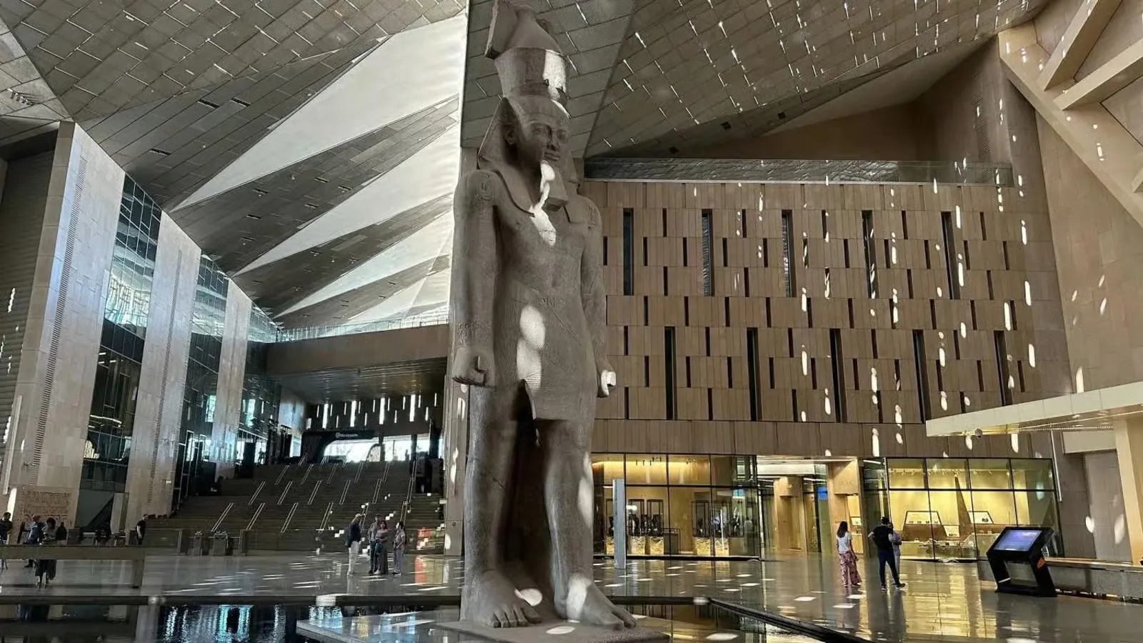 The colossal statue of Ramses II in the Grand Egyptian Museum atrium