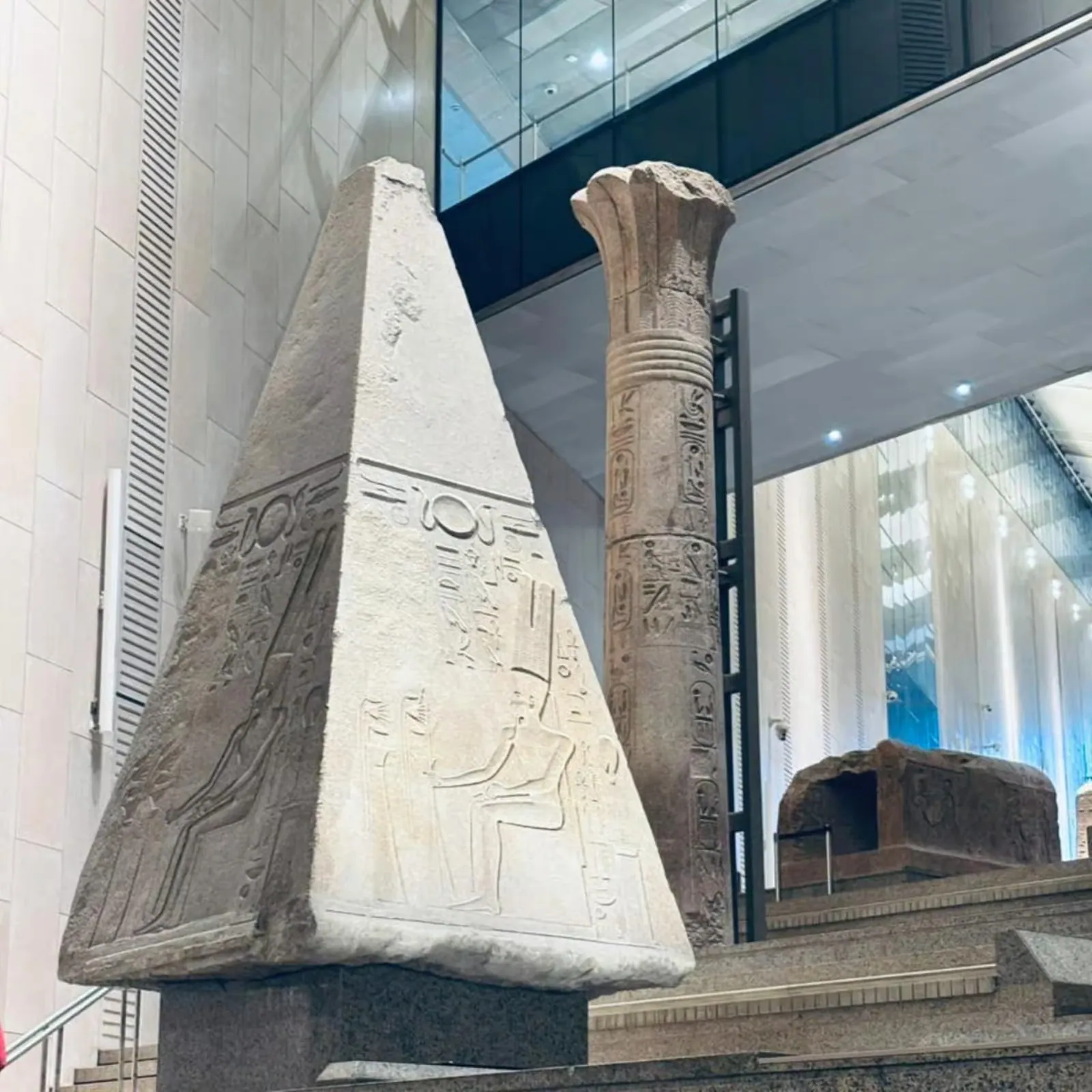 An obelisk and lotus column at the Grand Egyptian Museum
