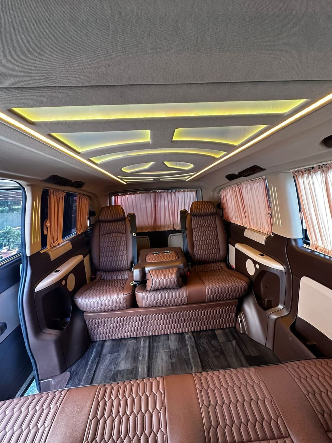 Luxury VIP van interior with leather captain seats and ambient lighting